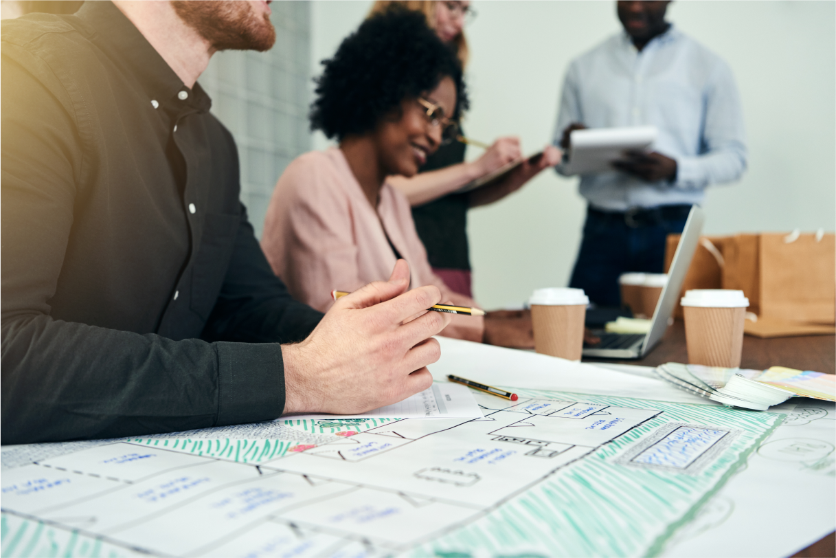 diverse-group-of-designers-working-with-blueprints-2023-11-27-04-50-12-utc 1 (1)